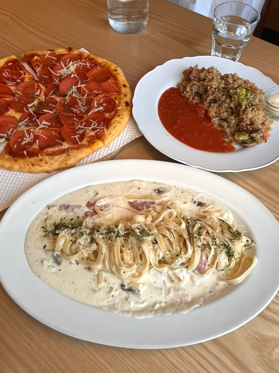 The full spread of dishes ordered by the family of three