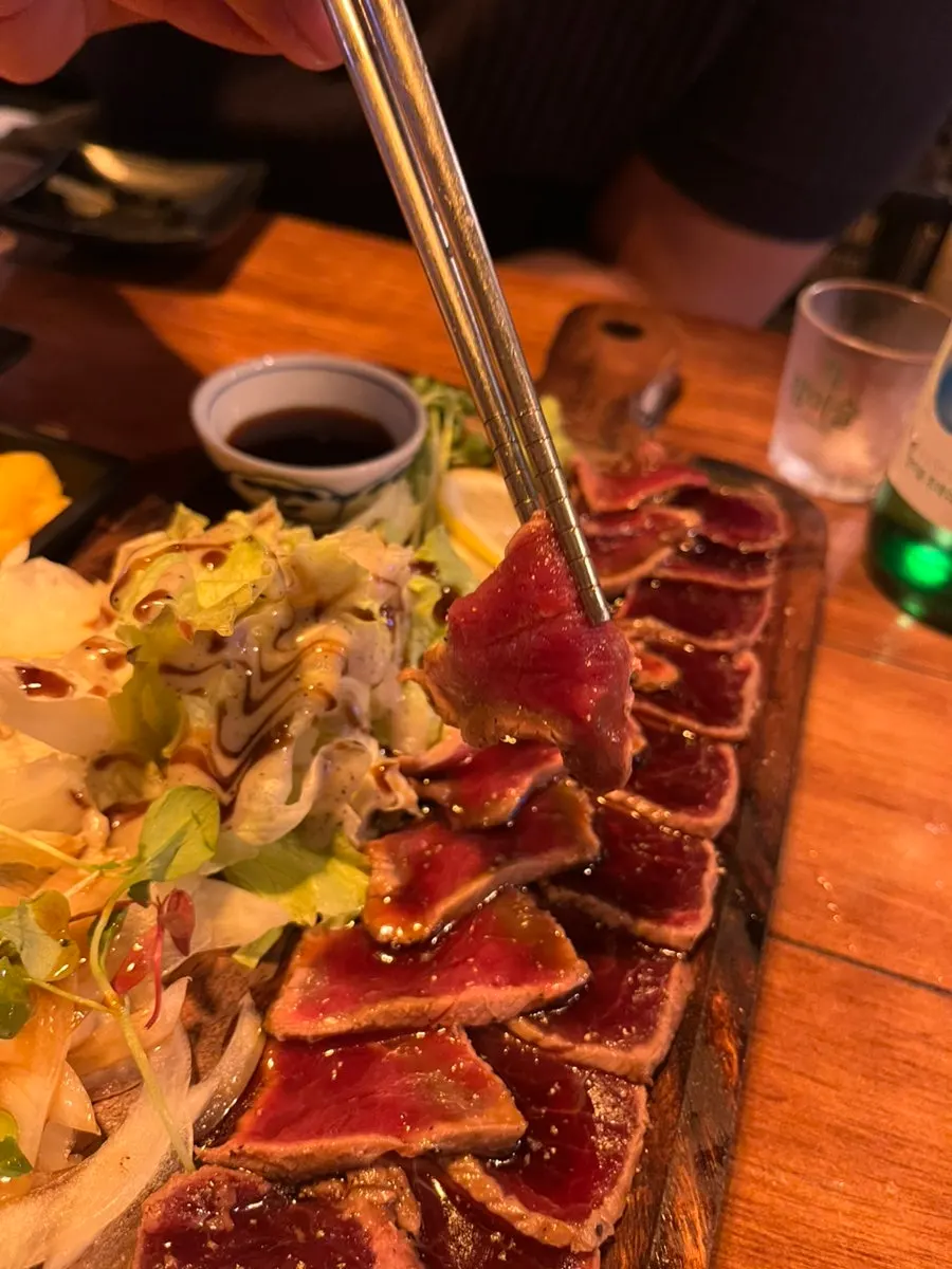 Beef tataki served with dipping sauce