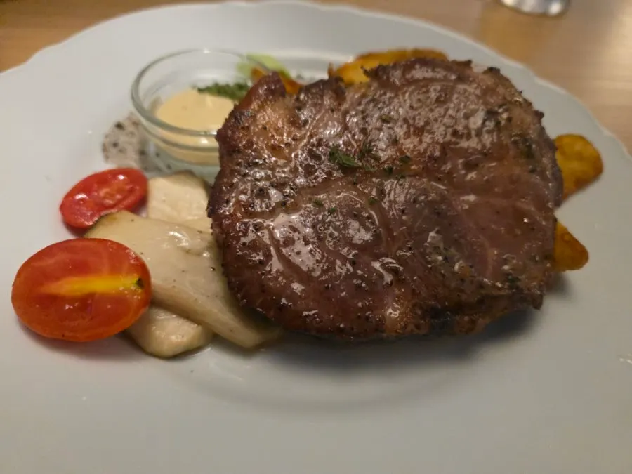 Sous-vide pork neck served on a plate
