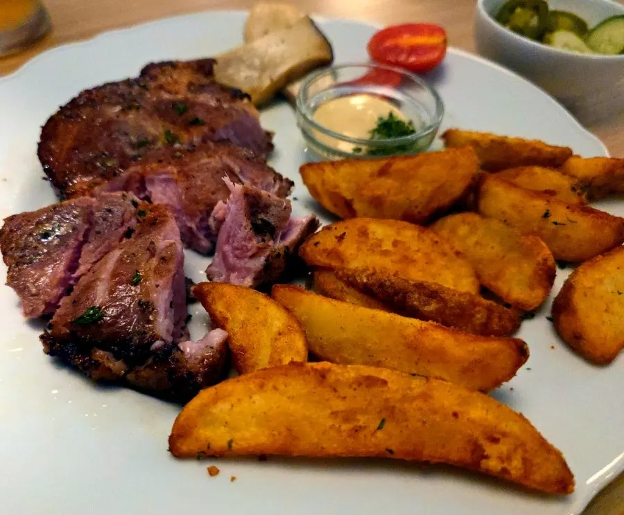 Cross-section of thickly sliced sous-vide pork neck