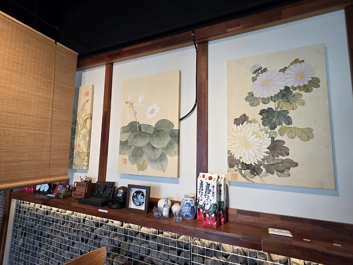Dining hall with wood-tone tables at Namhae Mulgogi Anyang