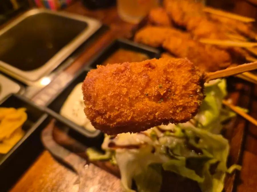 Fried food served with tartar sauce and chili sauce