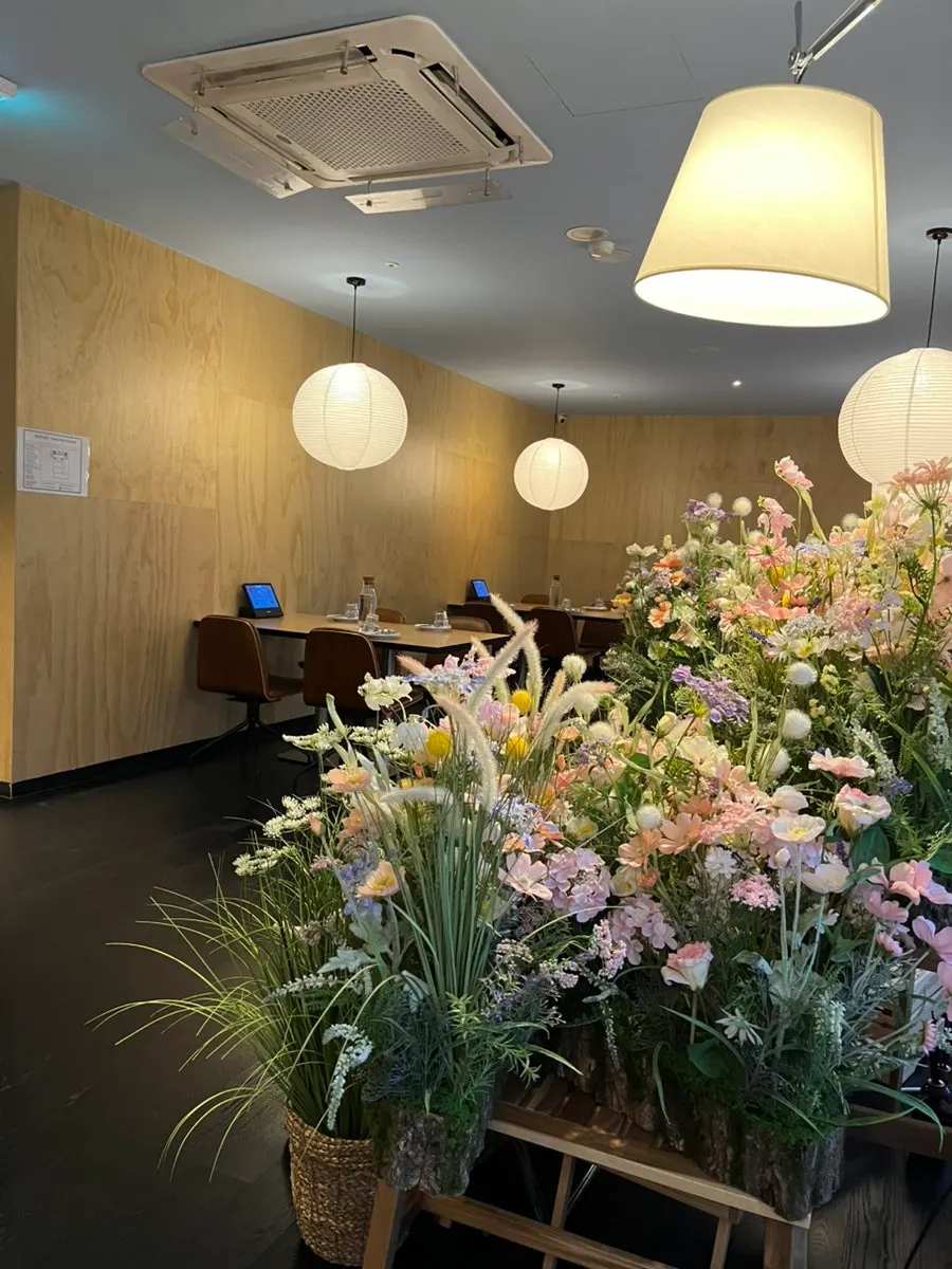 Interior of Two Find Peter Beomgye Branch with generously spaced tables