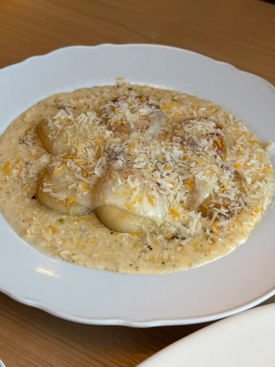 A plate of quattro cheese gnocchi