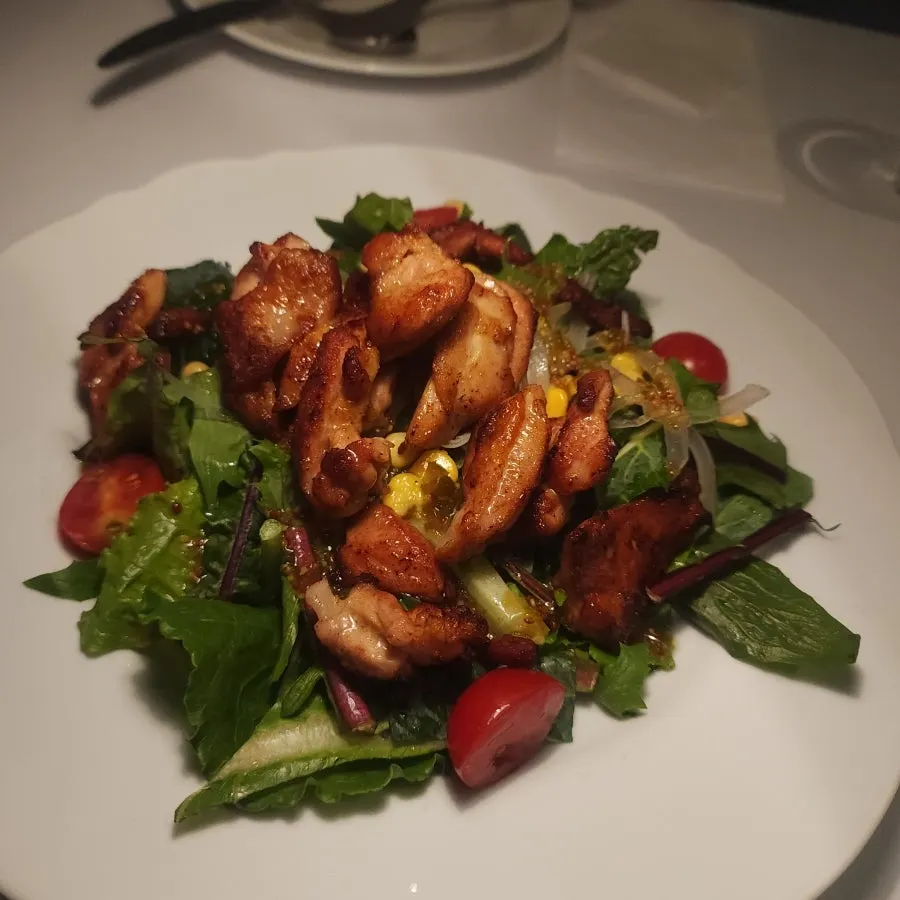Squid ink risotto topped with grilled squid