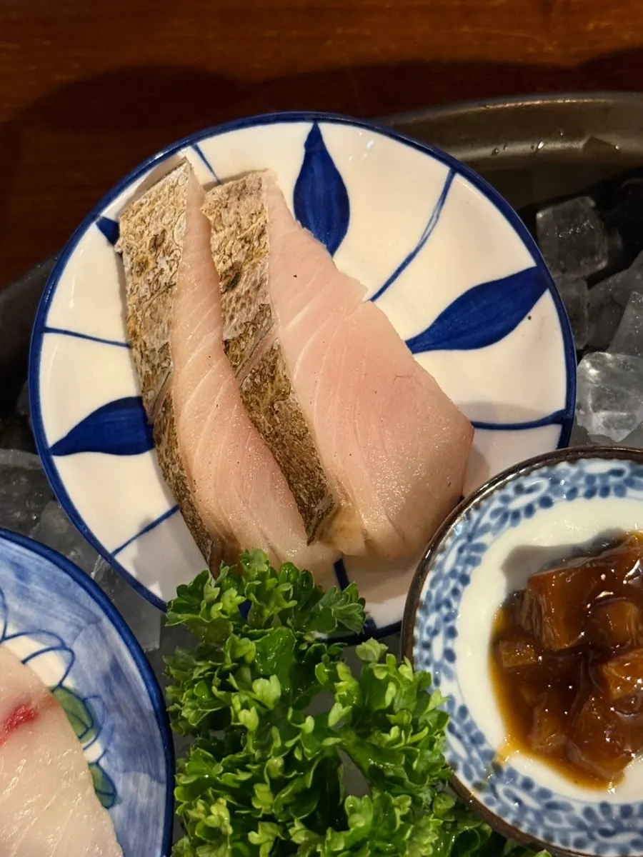 A piece of Spanish mackerel aged sashimi