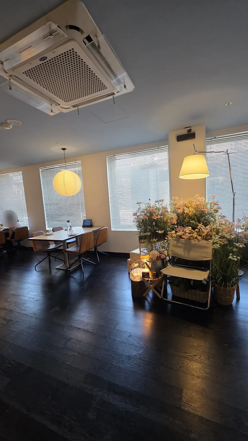 Dining zone with large framed artwork and lighting