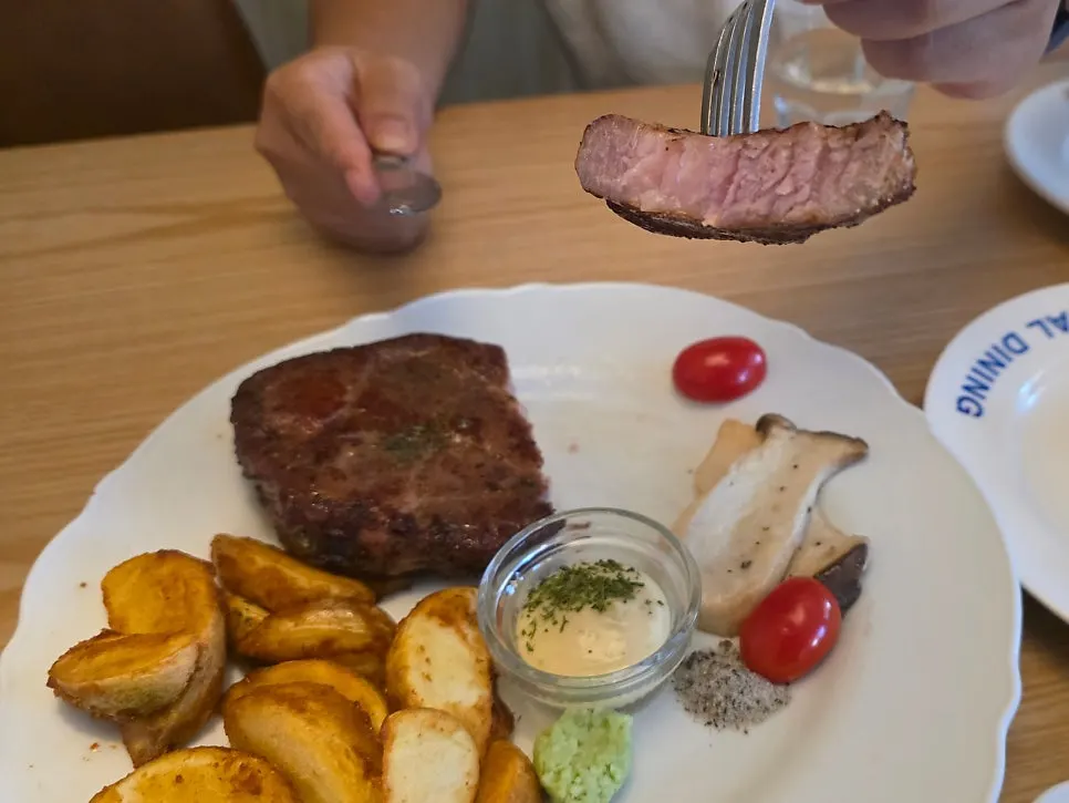 Close-up of sous-vide pork neck with wasabi