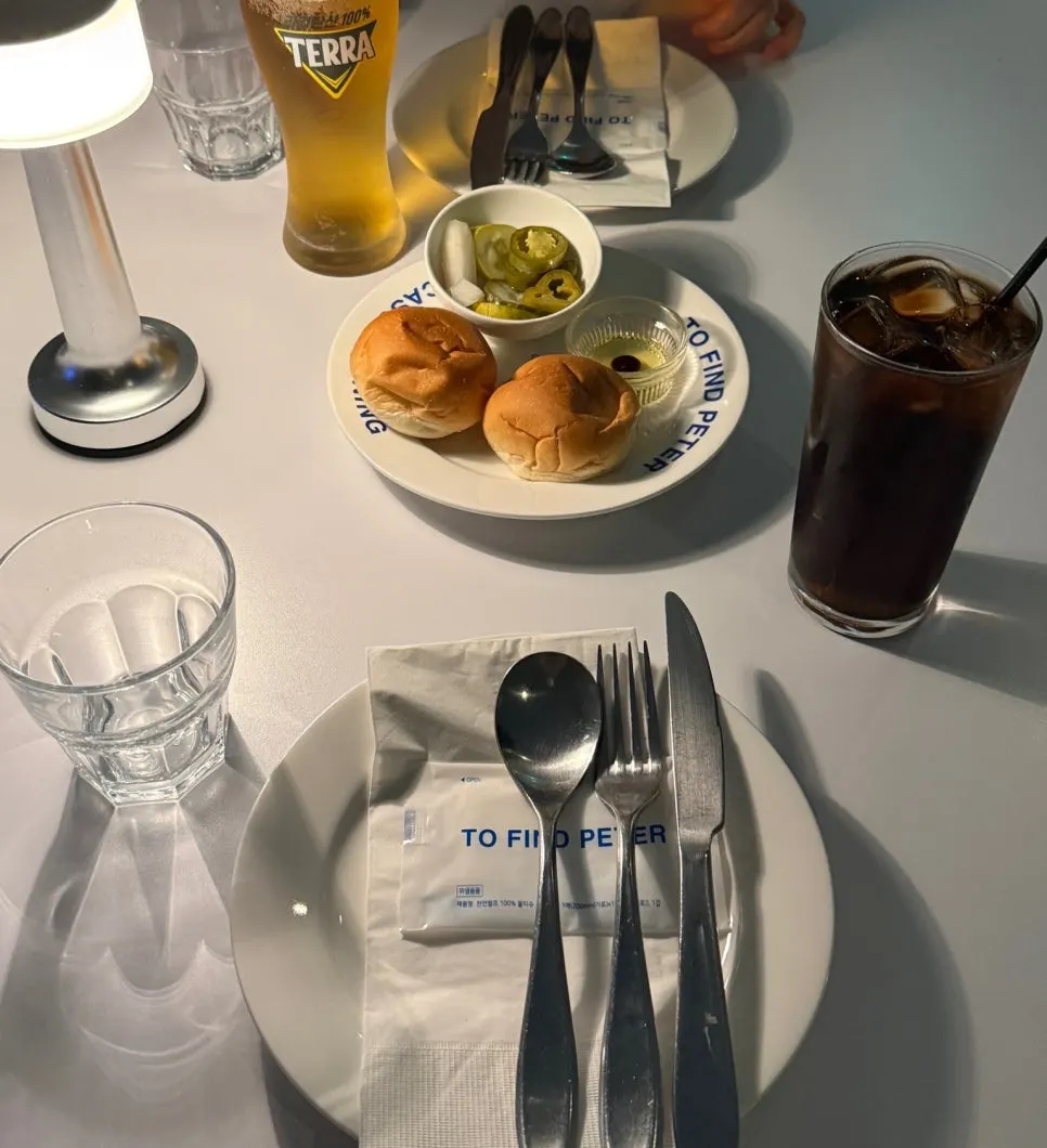 Complimentary bread, balsamic vinegar, and pickles