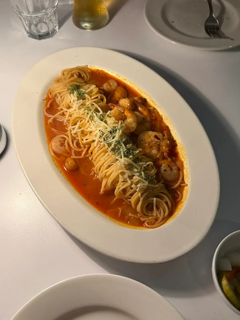 A generous portion of tomato sauce shrimp pasta