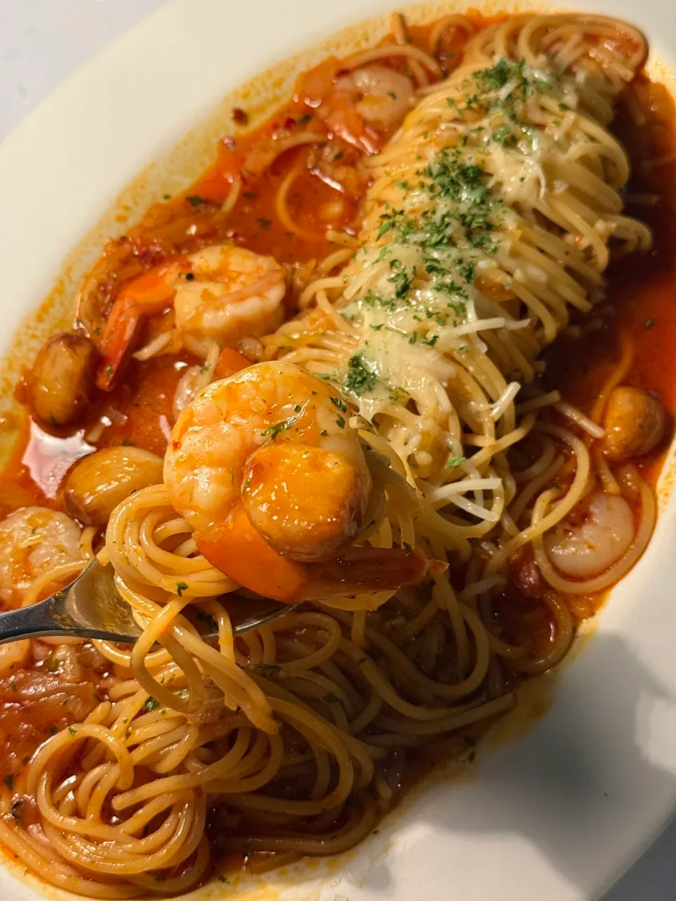 A plate of pasta enjoyed together with shrimp