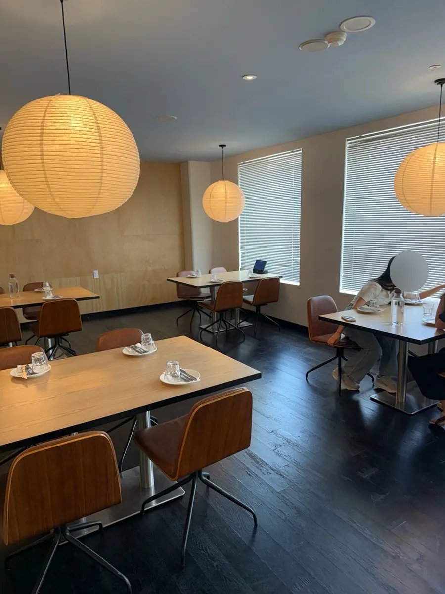 Modern dining hall seating under soft lighting