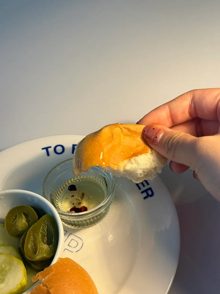 Bread dipped into olive oil