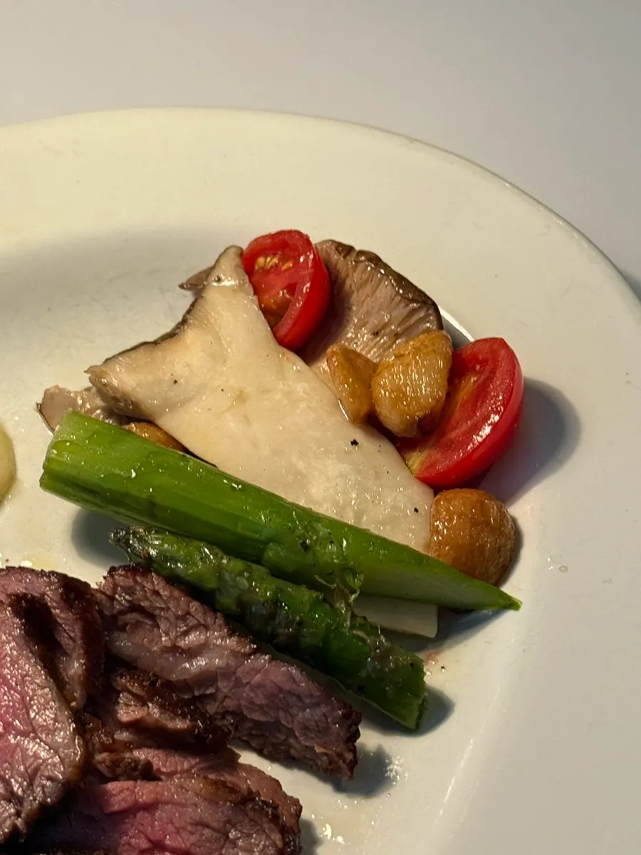 Grilled vegetable garnish served with the steak