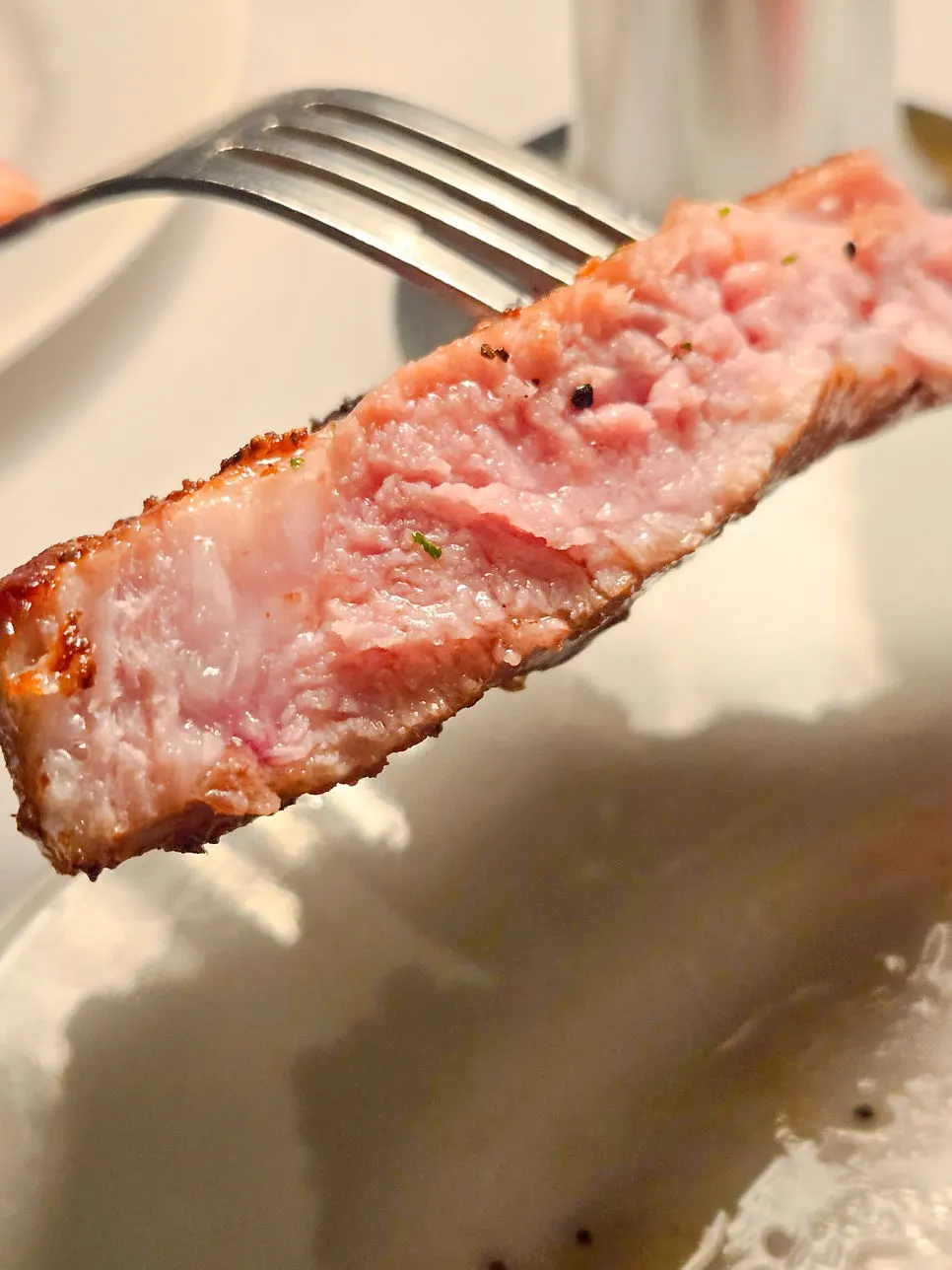 Close-up of a sliced pork neck steak