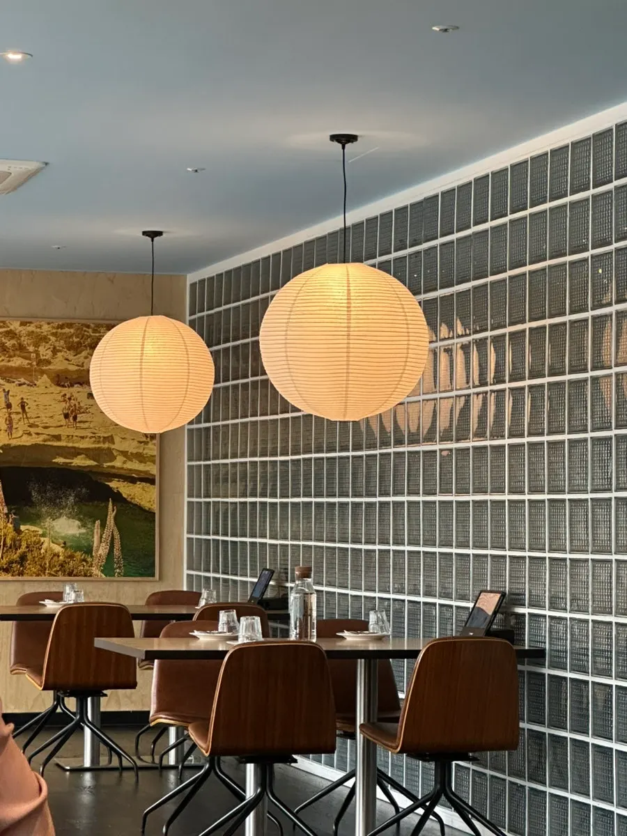 Interior of Two Find Peter Beomgye Branch with wood-toned tables