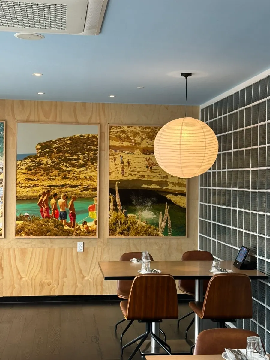 Full view of the interior with round pendant lights