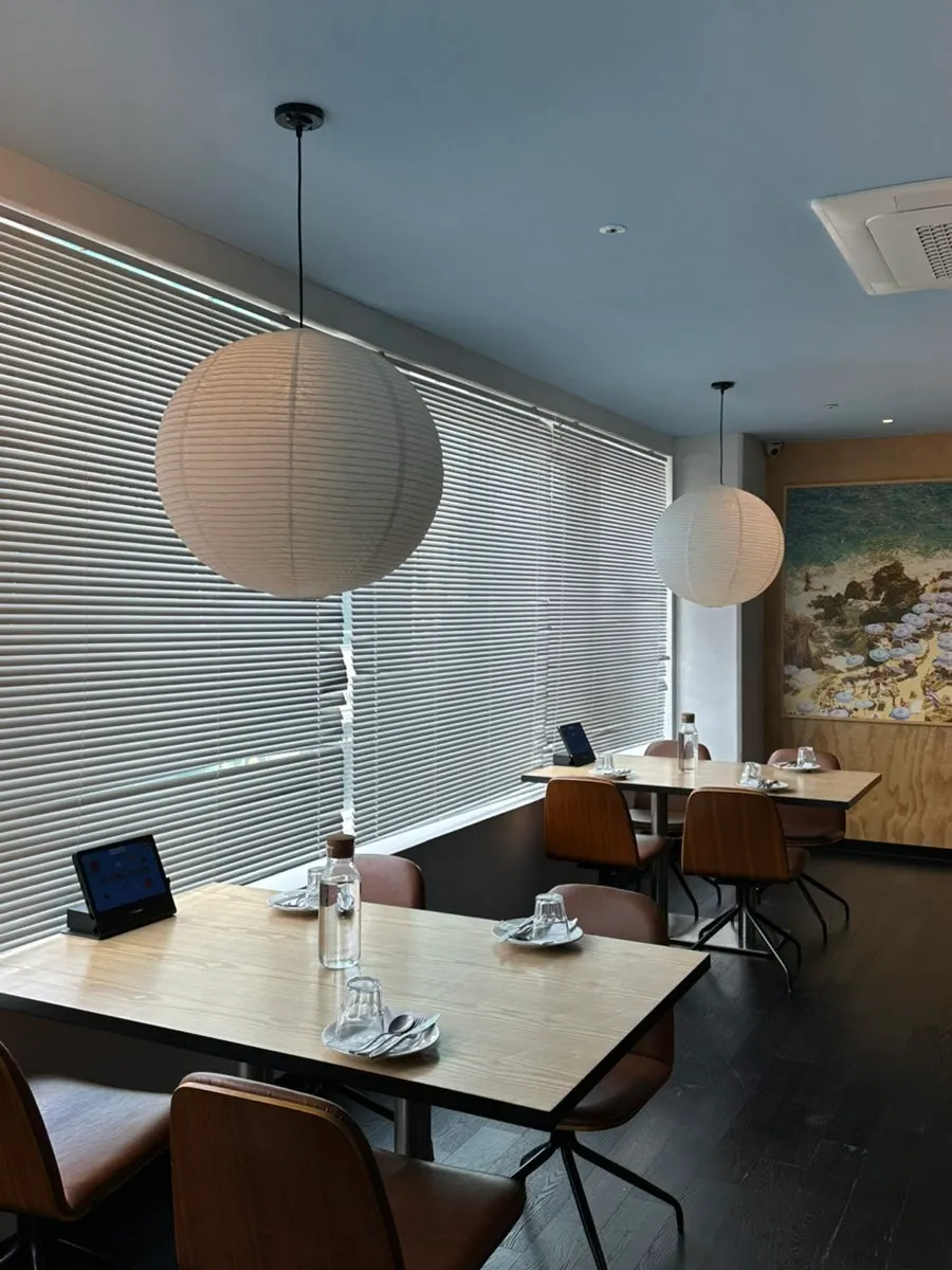 Seating area with an exotic feel from wall photos and paintings