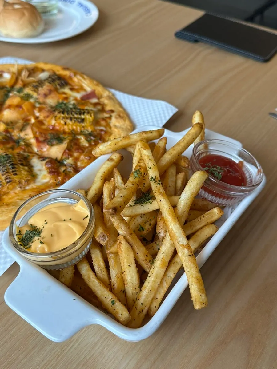Pasta and pizza on the table during the meal