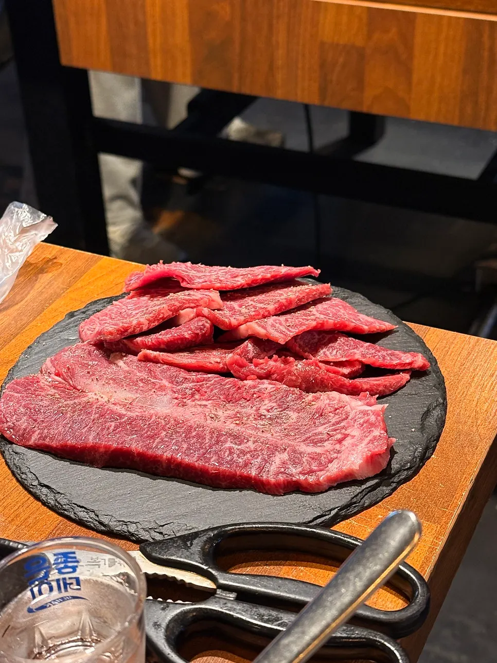 A piece of beef paired with dressed lettuce
