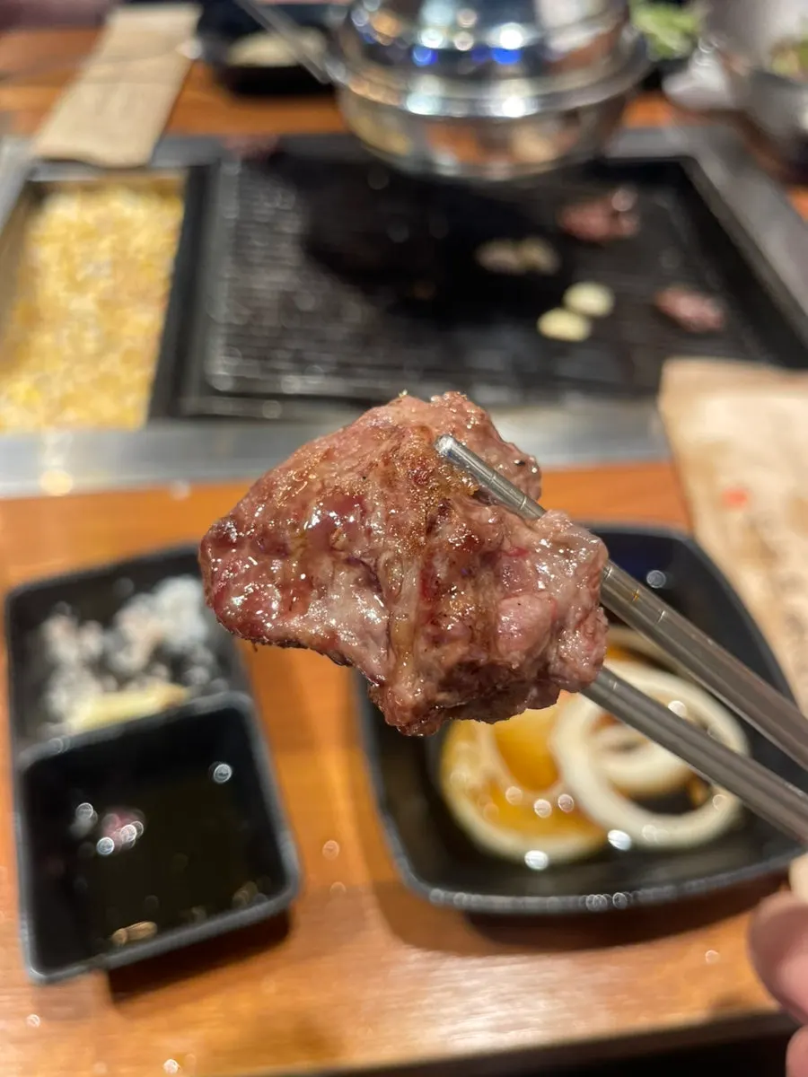 Shishito peppers and mushrooms grilled alongside the meat