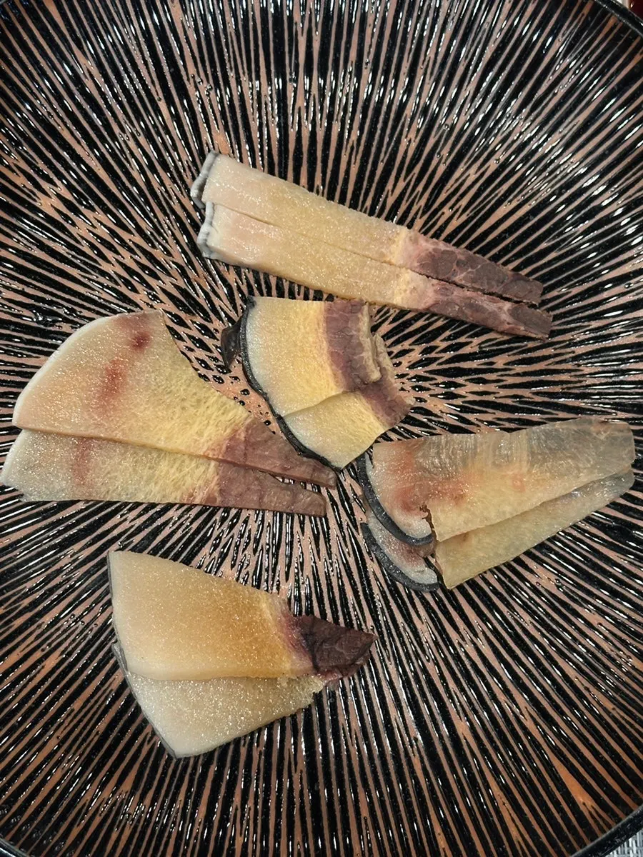 A piece of tuna enjoyed with drinks