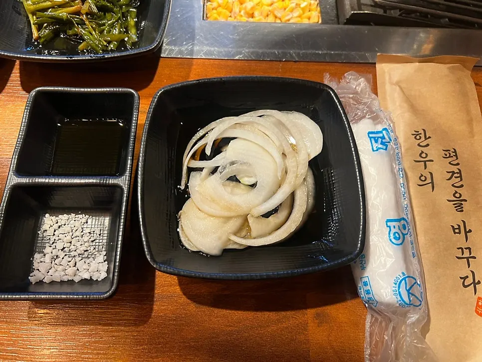 Two sauces and a plate of onion
