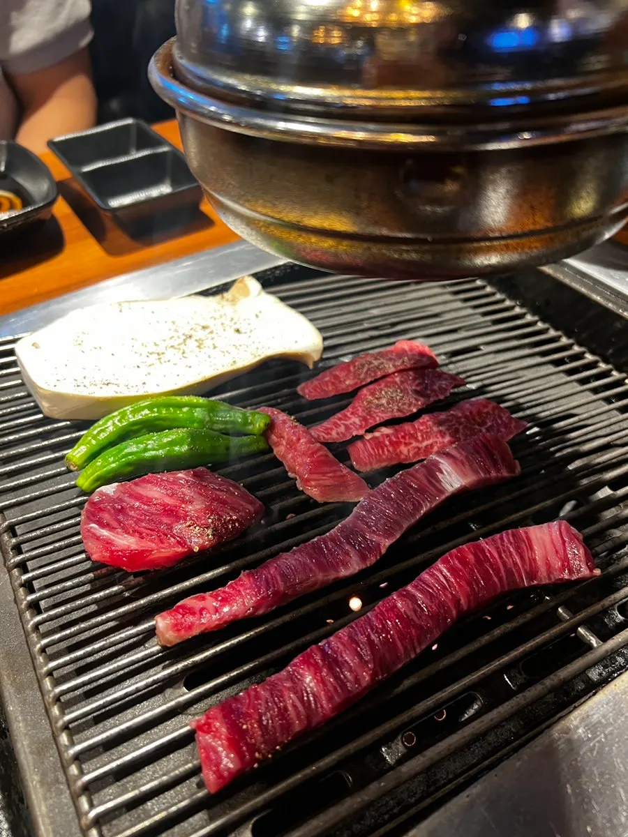 Skirt steak grilling on the pan