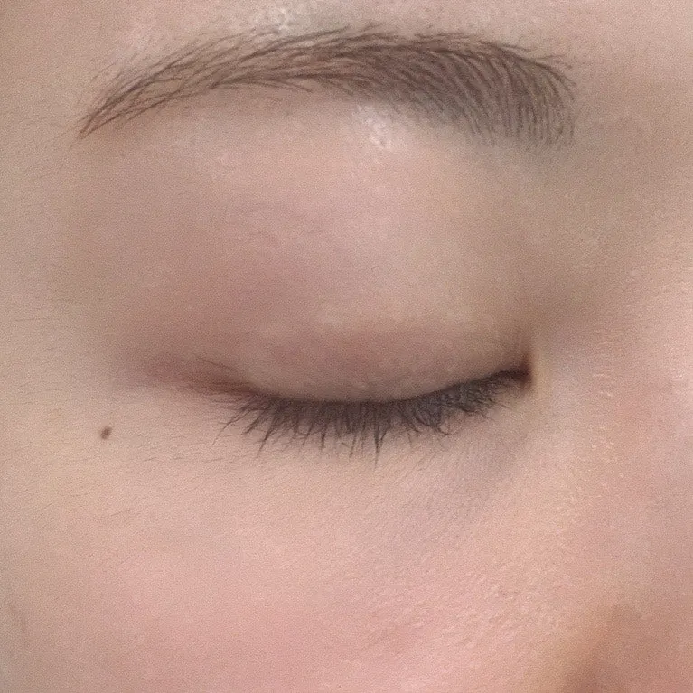 Mix of curled and straight lashes before treatment