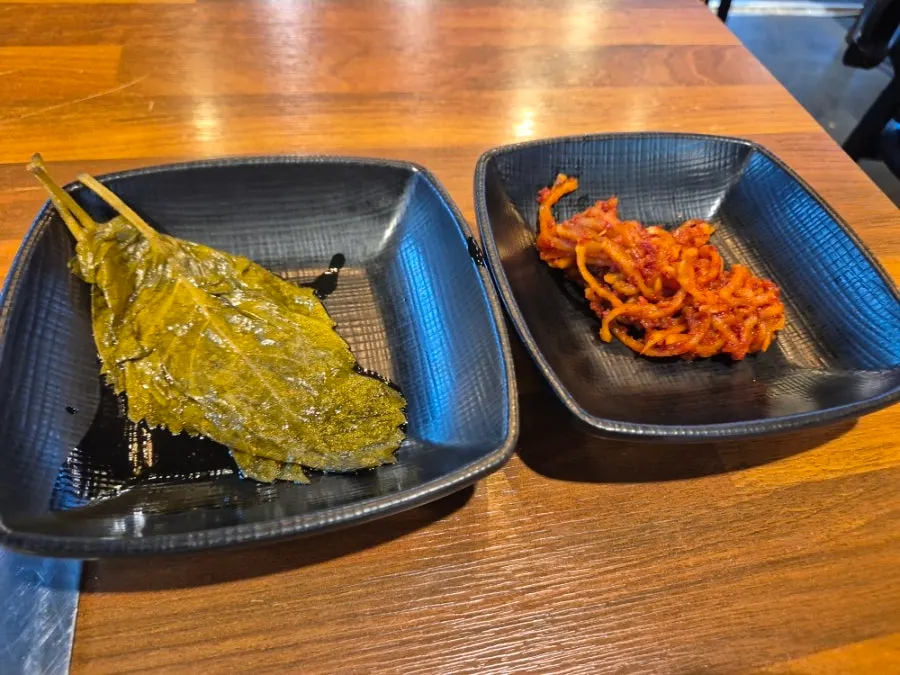 Table setting with side dishes and beef seaweed soup