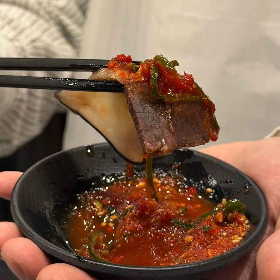 Whale meat enjoyed with salt and sauce