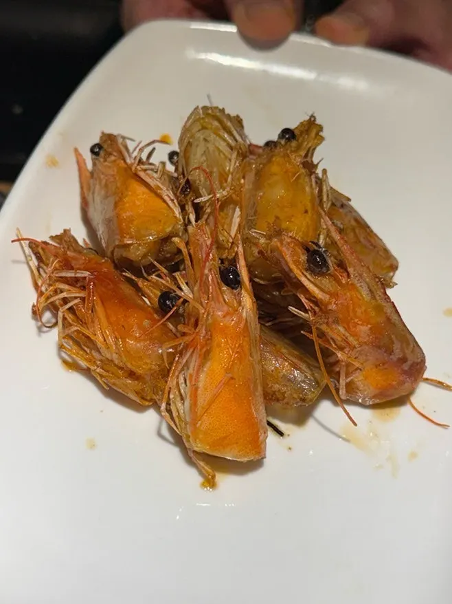 Shrimp heads grilled golden in butter