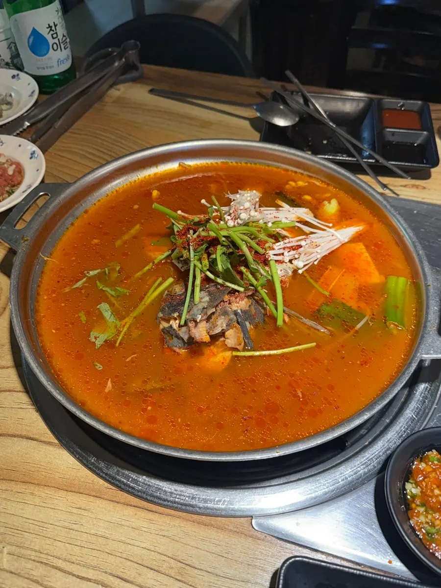 A big pot of generously portioned spicy fish stew