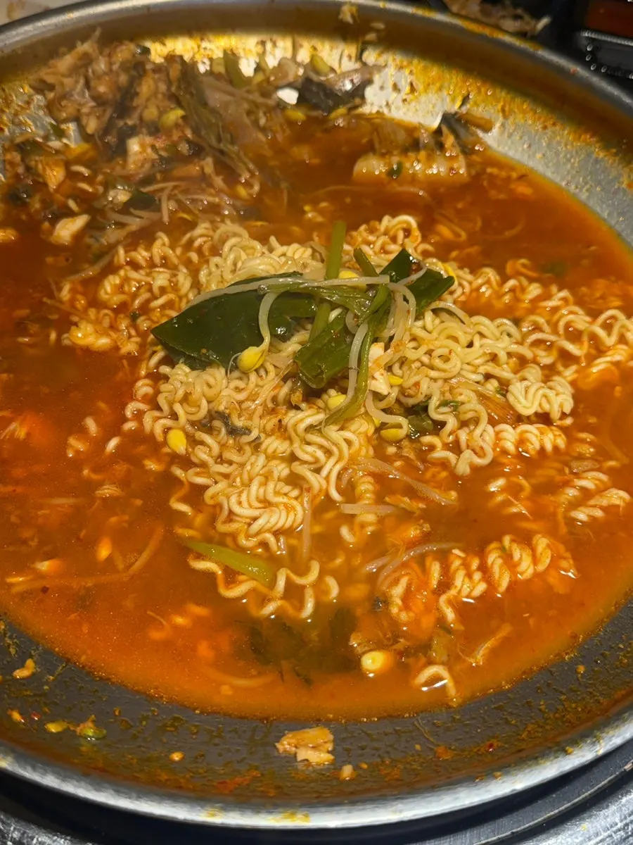 Spicy fish stew simmering with plenty of fish bone