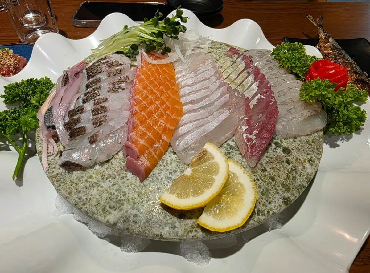 Main photo of a full sashimi spread at Veteran Fish Market Incheon City Hall Branch