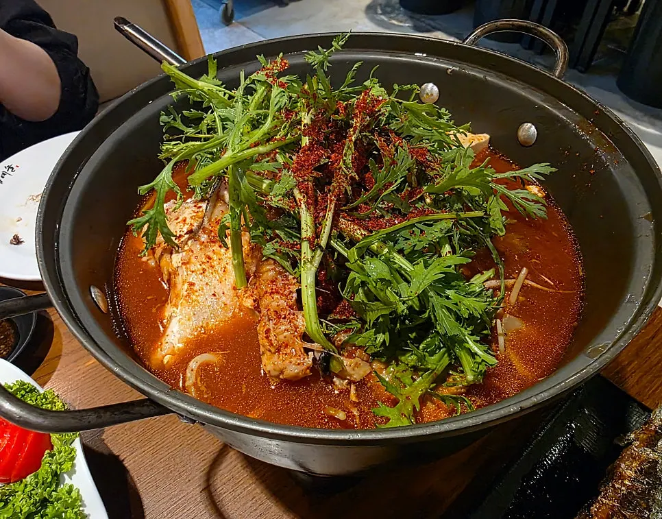 Fish-bone spicy stew served with a bowl of rice