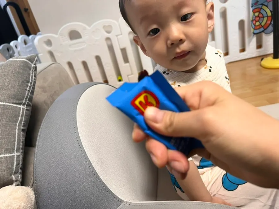 Child opening their mouth while waiting for jelly