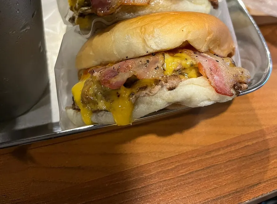 Cross-section of a bitten Double Bacon Cheese Burger