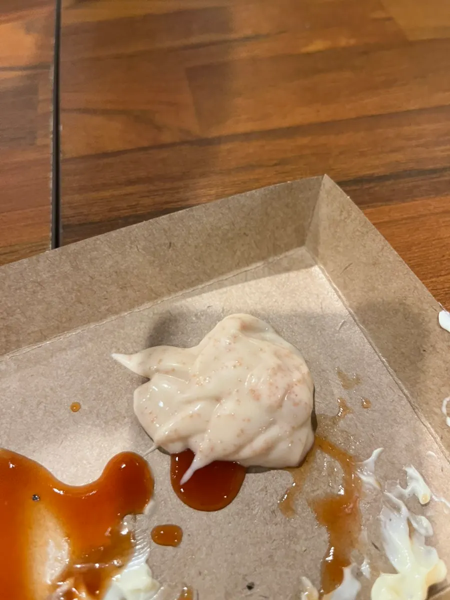Fries dipped in myeongran mayo sauce