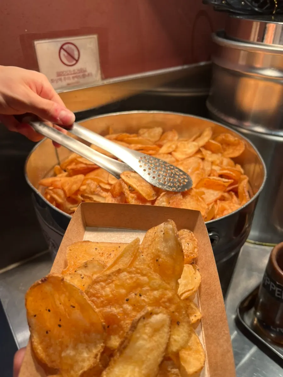 Table with potato chips and sauces
