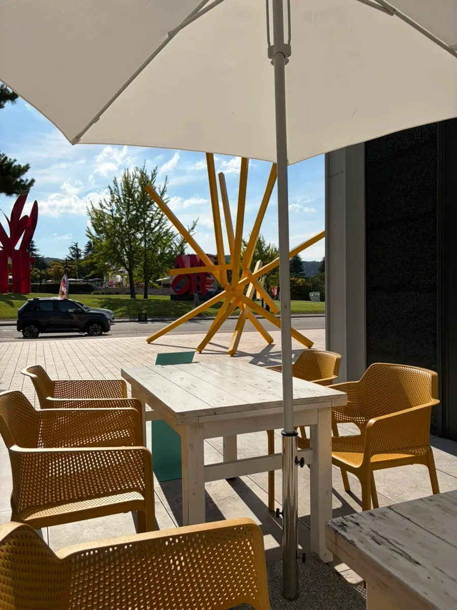 View of the Hilton sculpture and lawn in front of the terrace