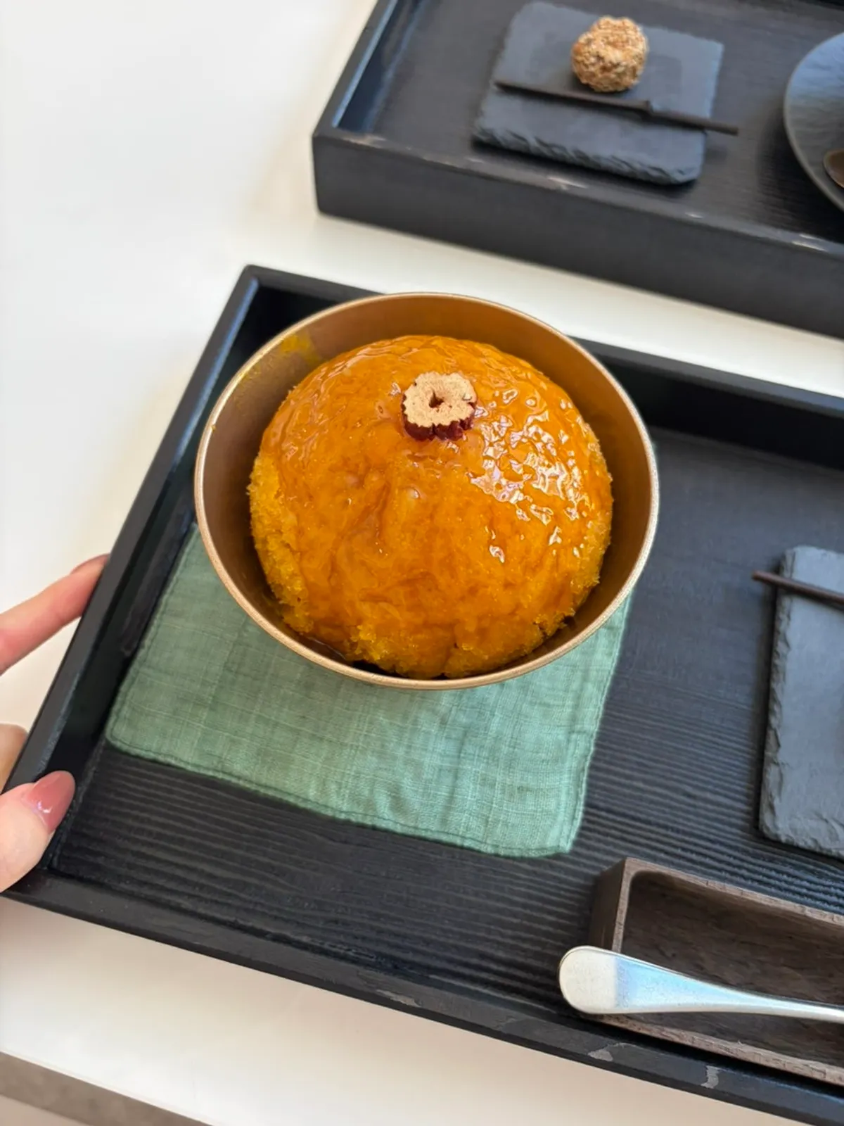 Sweet pumpkin bingsu for one with a side of black sesame rice cake