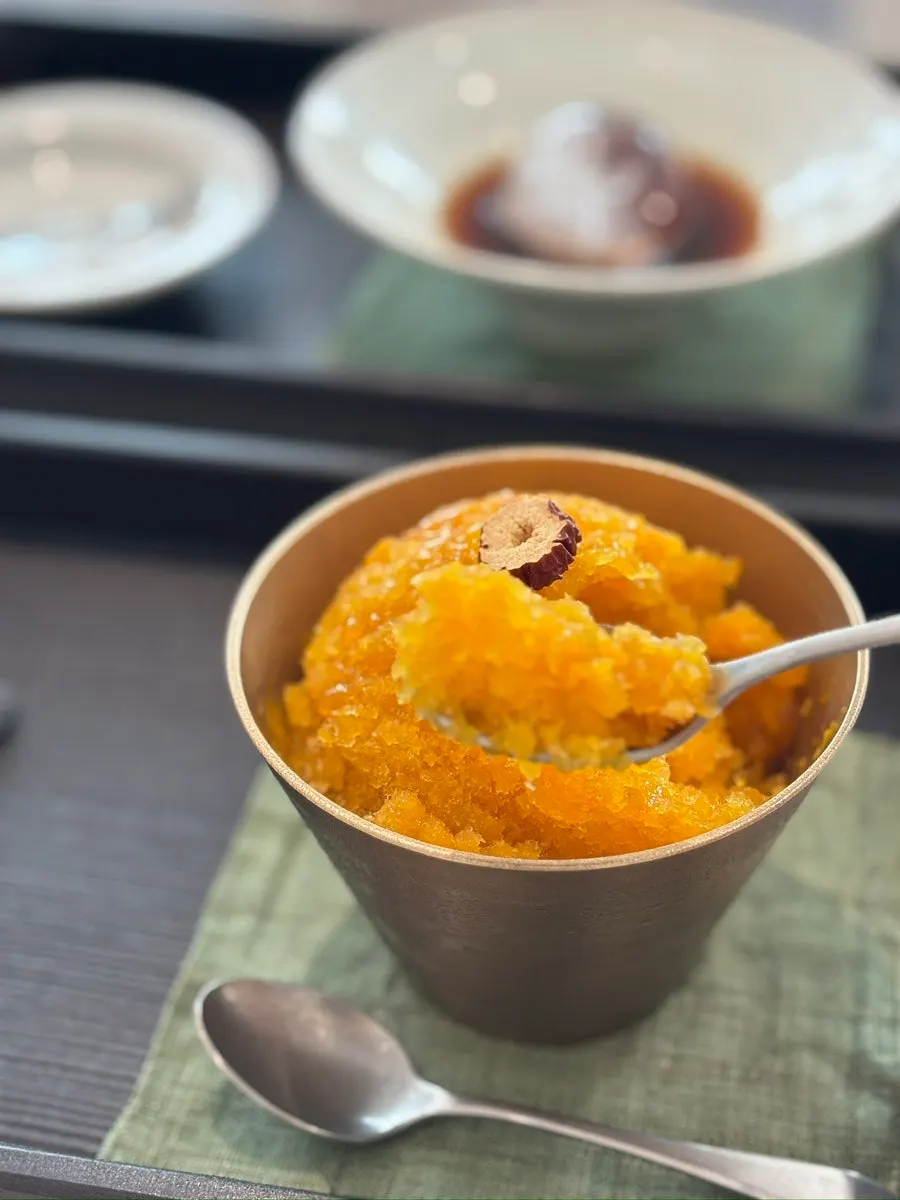 Coffee and dessert served on upscale tableware at Bibibidang Gyeongju