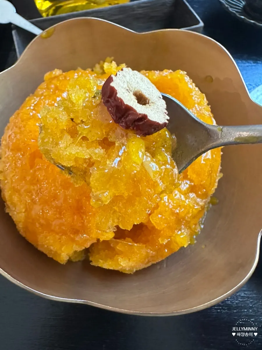 Close-up of pumpkin bingsu topped with rice syrup