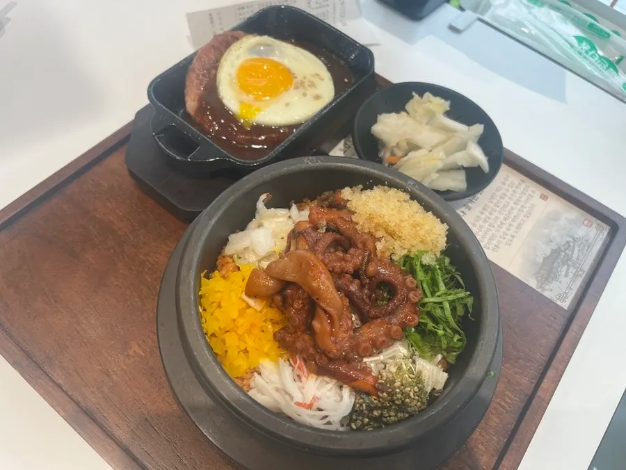 Octopus bibimbap and hanpork tteokgalbi set in a stone pot