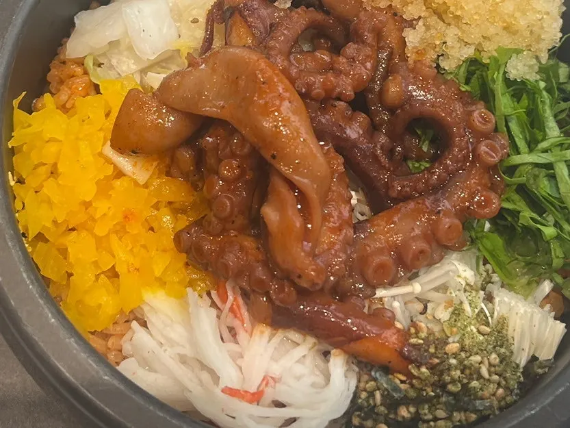 Stone-pot bibimbap topped with octopus and flying fish roe