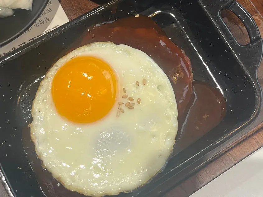 Hanpork tteokgalbi with a soft-yolk fried egg on a mini griddle