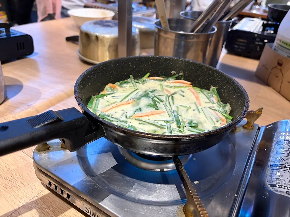 Free self-serve jeon corner for grilling green onion pancake and kimchi pancake