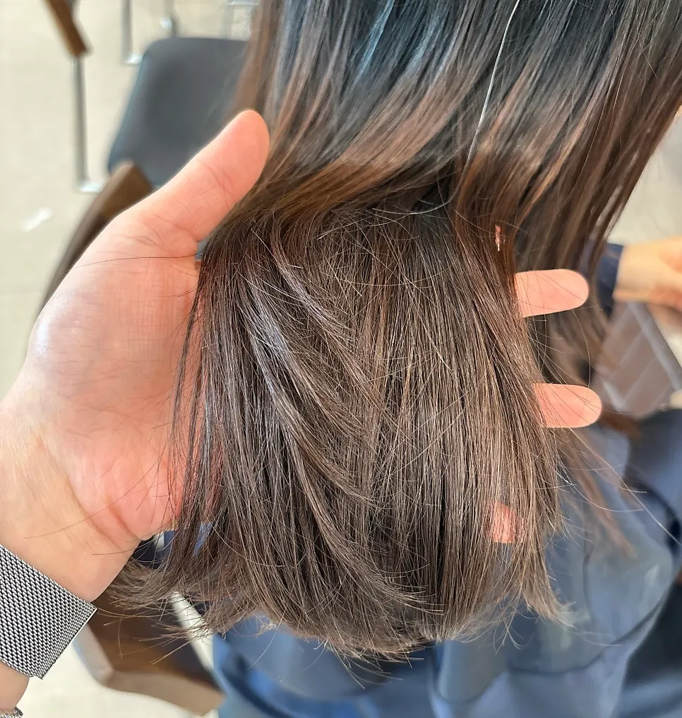 Designer consulting and checking hair condition