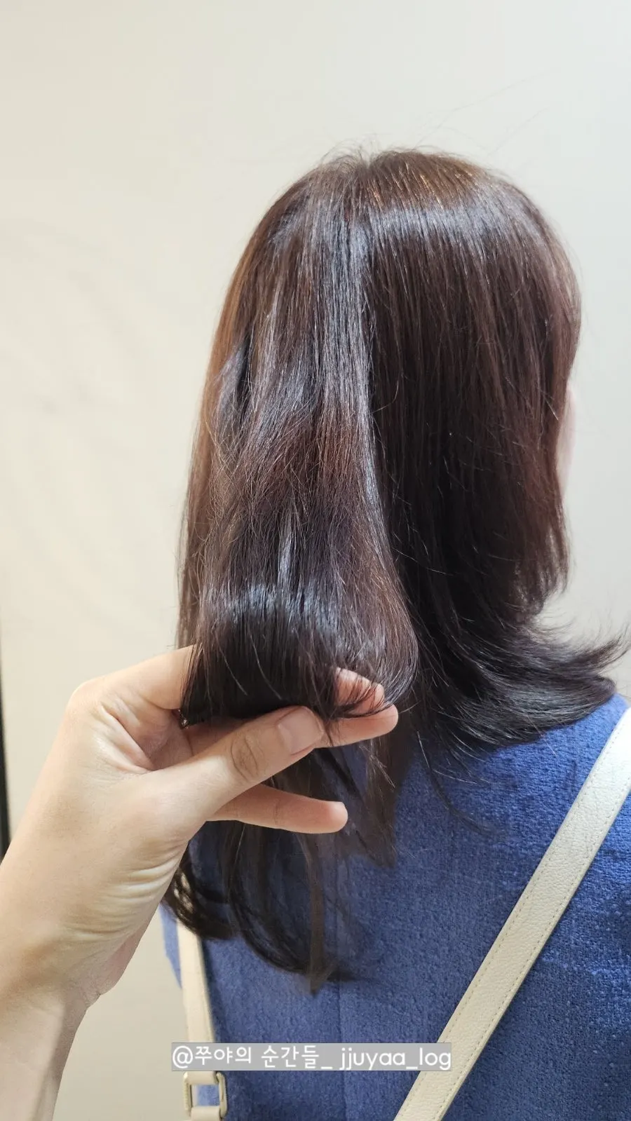 Full-body back view after the straightening treatment